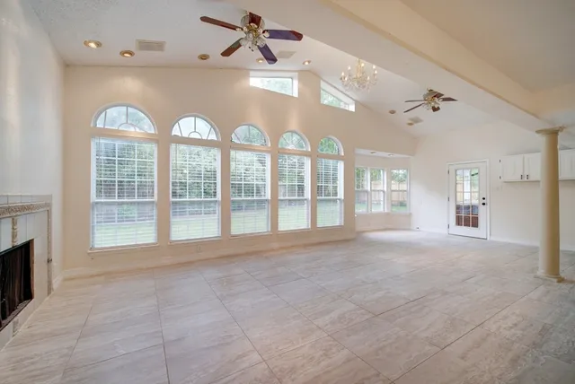 a view of an empty room with a window
