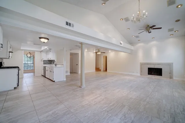 a view of a kitchen with furniture and a fireplace