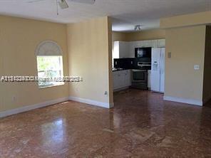 Surfside Surfside, FL 33154 - Photo 3 of 9 a view of a kitchen with a sink and dishwasher kitchen view with wooden floor