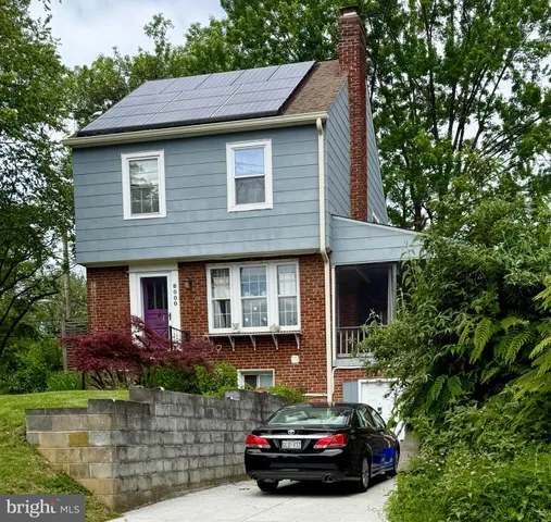 a car parked in front of a house