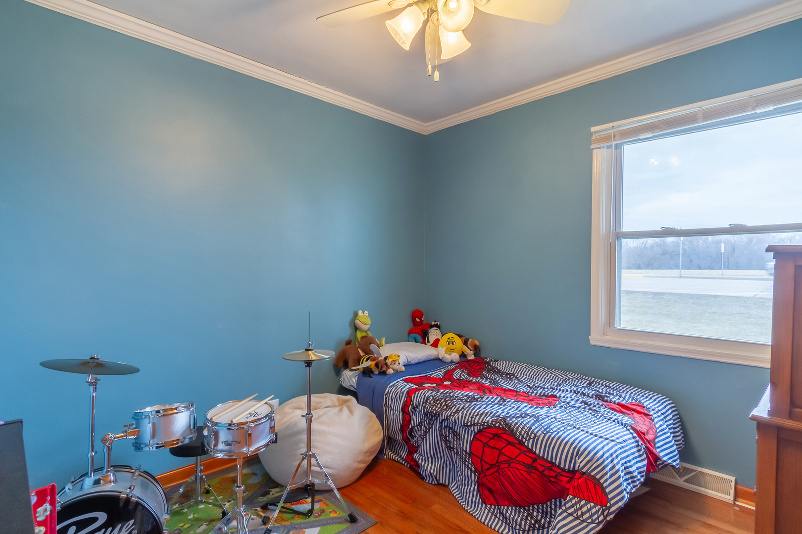 800 Orchard Road Montgomery, IL 60538 - Photo 13 of 21 a bedroom with a bed a chandelier and a window