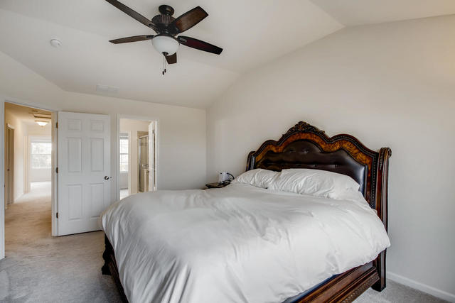 2891 Church Road Aurora, IL 60502 - Photo 14 of 28 a bedroom with a bed and a ceiling fan