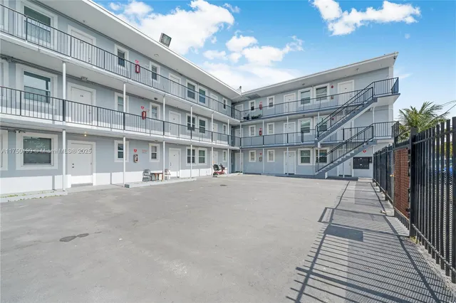 a view of city from balcony with furniture