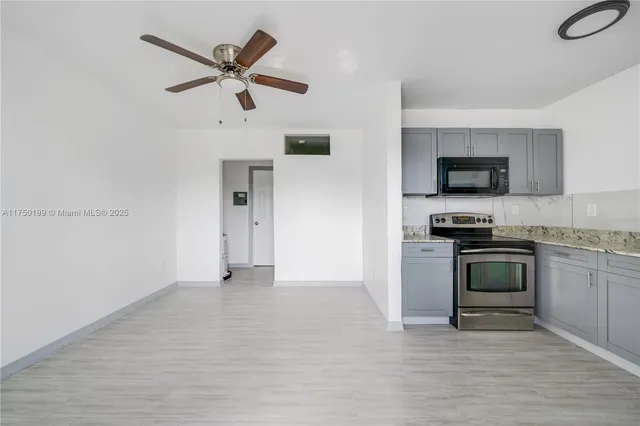 a kitchen with a stove and a microwave