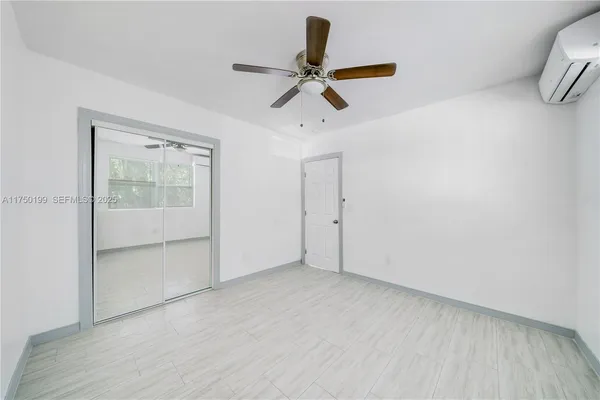 a view of an empty room with a window