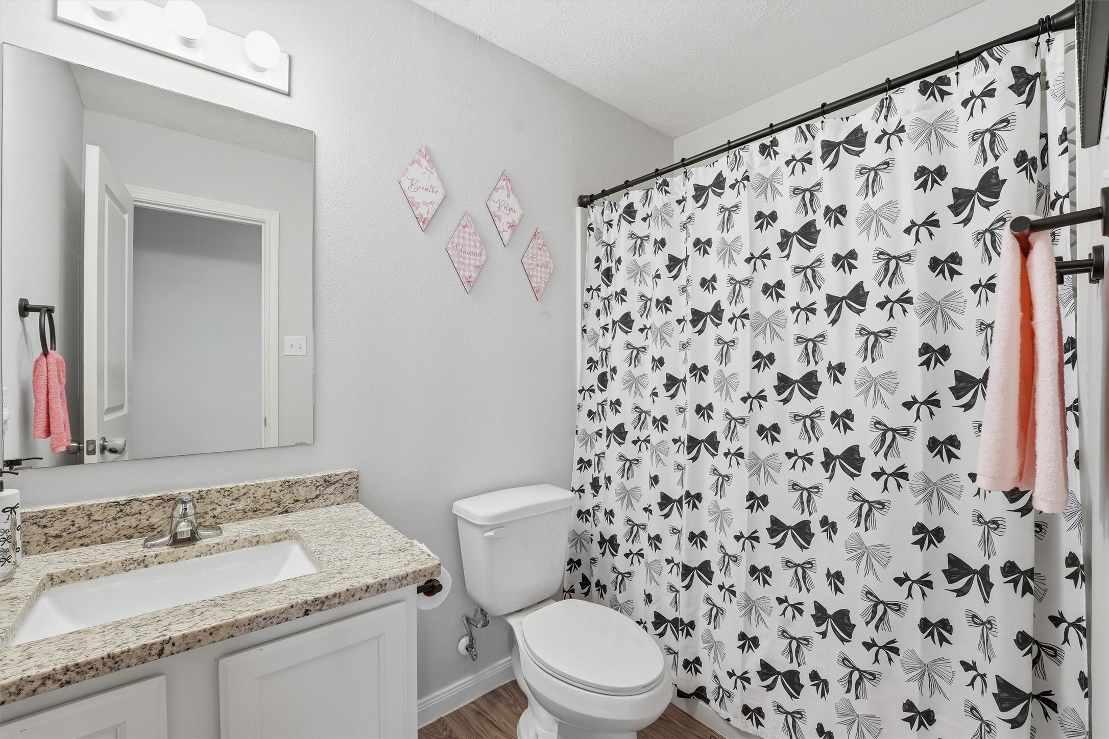 15011 Crockett Road Willis, TX 77378 - Photo 16 of 24 Full secondary bathroom with clean, modern design.