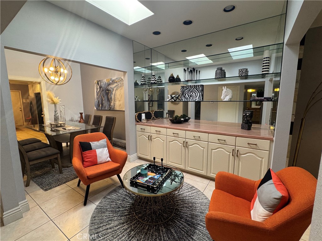 72399 Ridgecrest Lane Palm Desert, CA 92260 - Photo 3 of 11 a living room with furniture kitchen and a chandelier