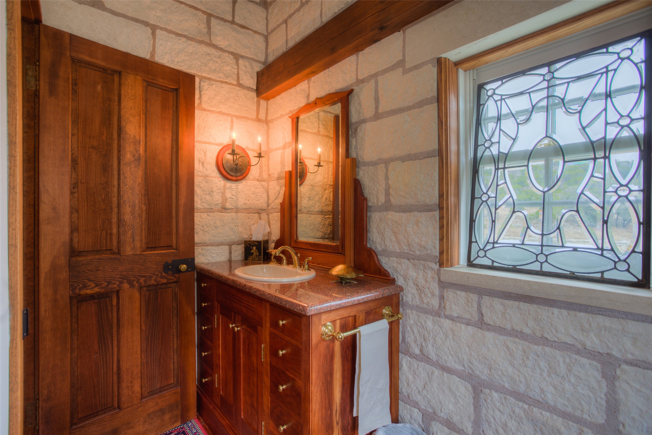 3777 Middle Creek Road Blanco, TX 78606 - Photo 17 of 40 a bathroom with a sink and a mirror