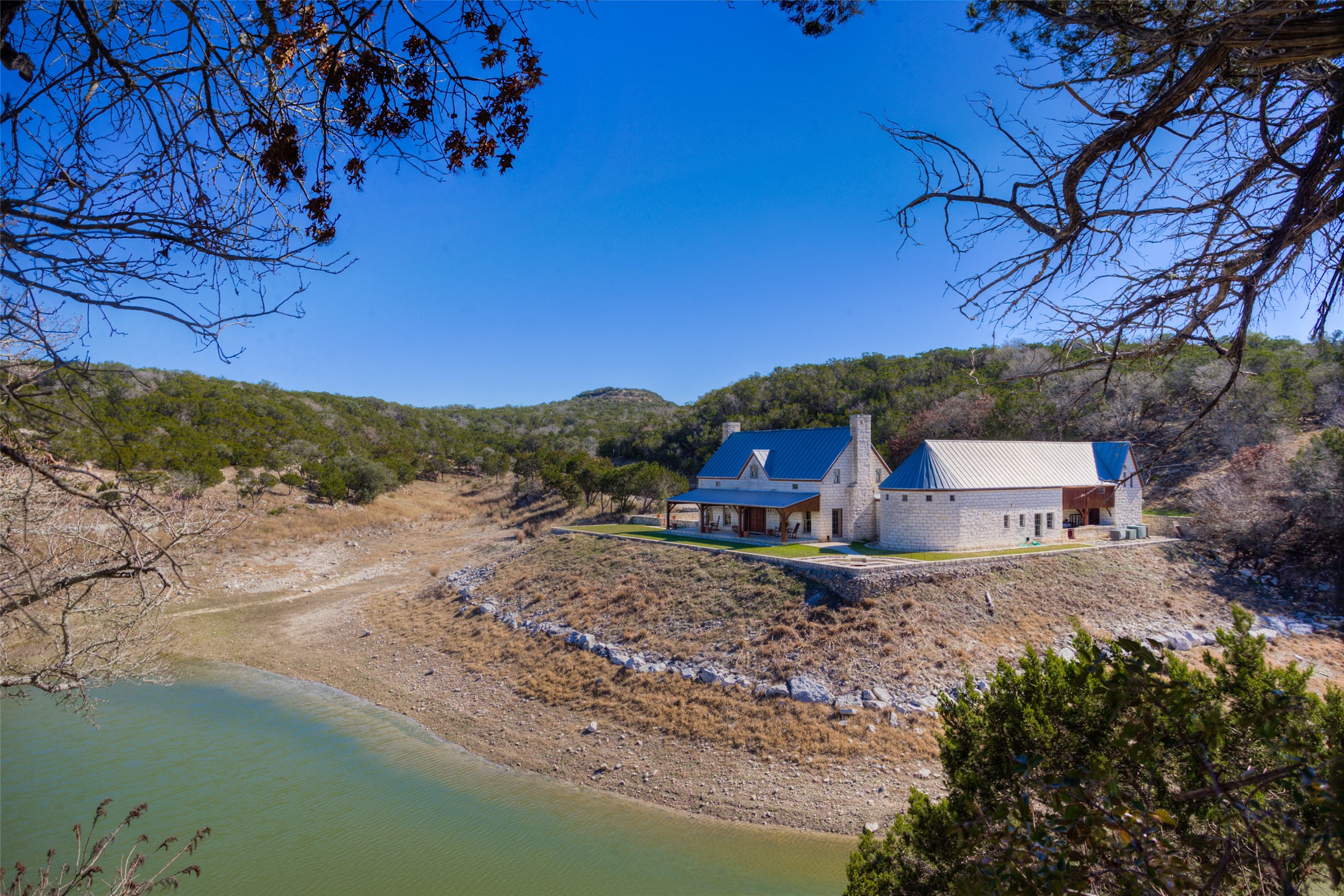3777 Middle Creek Road Blanco, TX 78606 - Photo 2 of 40 a view of a house with a yard