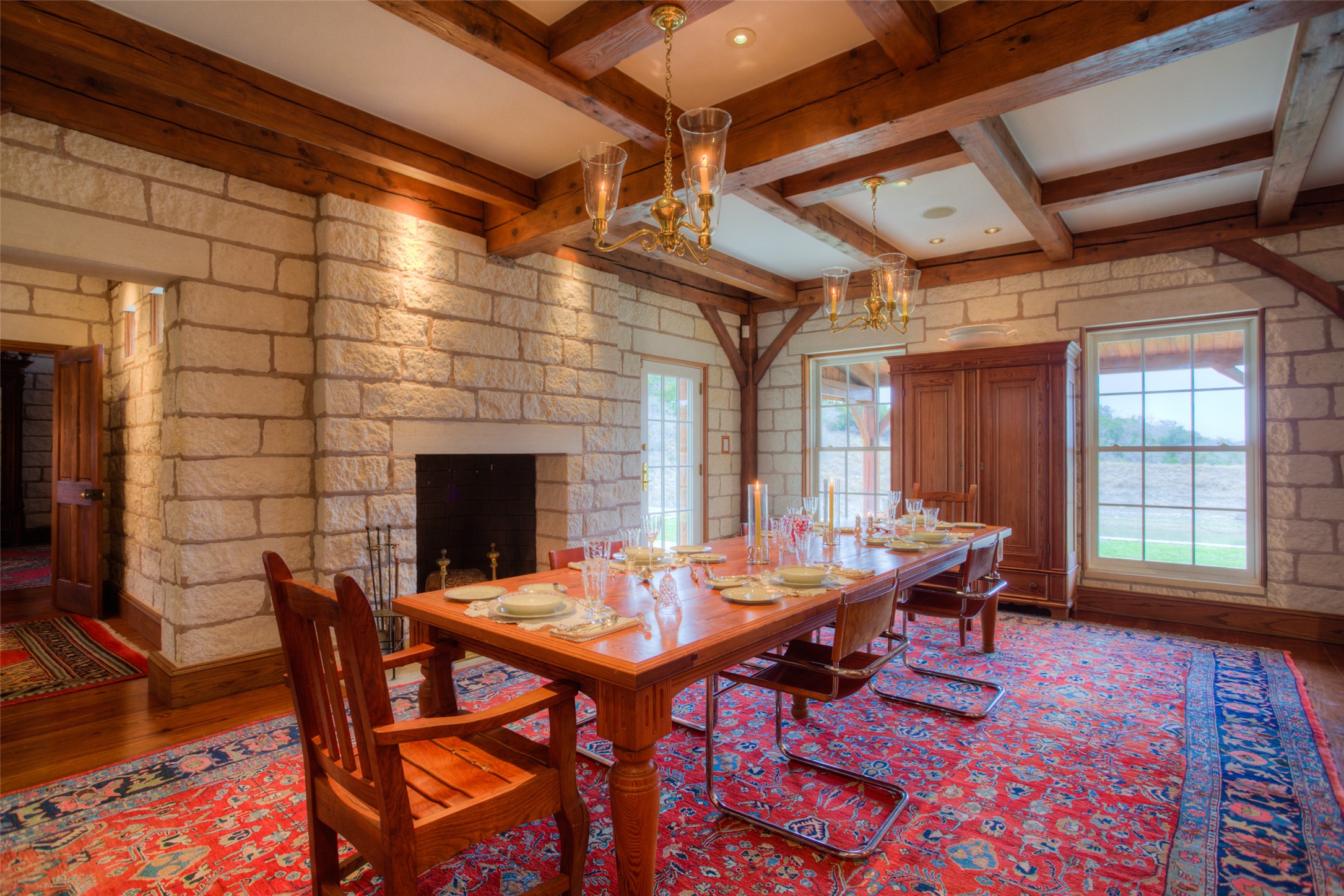 3777 Middle Creek Road Blanco, TX 78606 - Photo 22 of 40 a view of a dining room with furniture window and wooden floor
