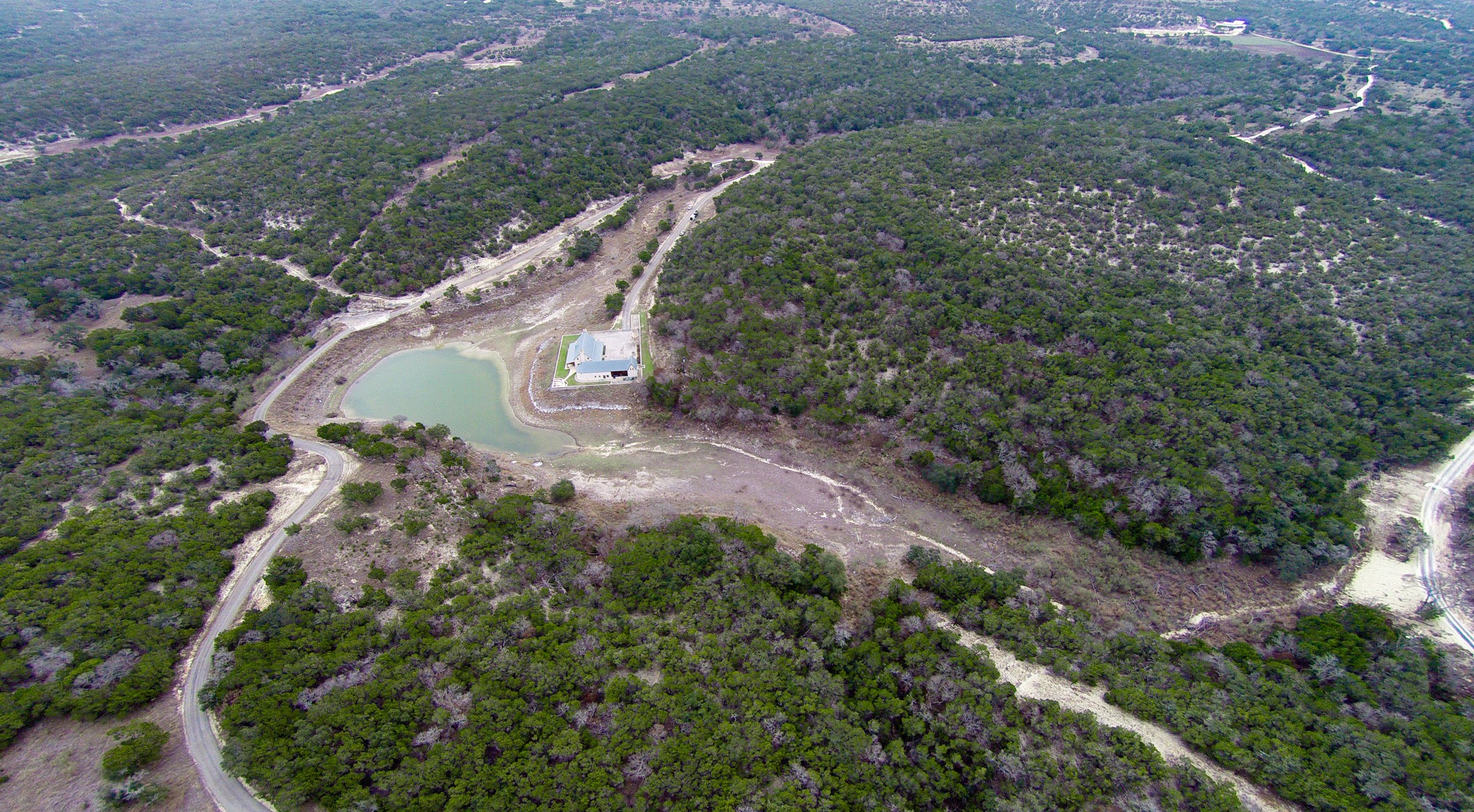 3777 Middle Creek Road Blanco, TX 78606 - Photo 32 of 40 a view of a lush green forest with lots of trees