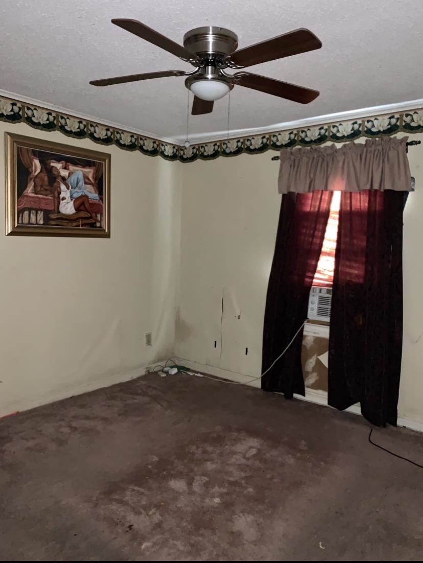 3741 Rhodes Avenue Memphis, TN 38111 - Photo 2 of 5 Spare room featuring carpet flooring and ceiling fan