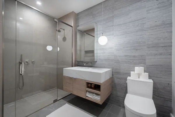 a bathroom with a sink toilet and shower