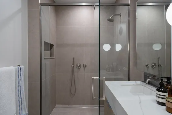 a bathroom with a tub a sink and shower