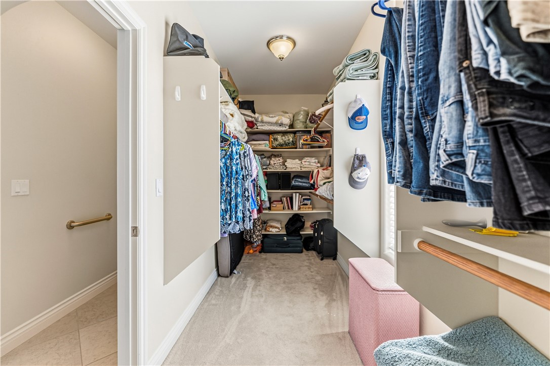 3315 Rainbow Mine Road Kingman, AZ 86401 - Photo 28 of 54 Spacious walk-in closet featuring extensive built-in shelving, hanging rods, and recessed lighting