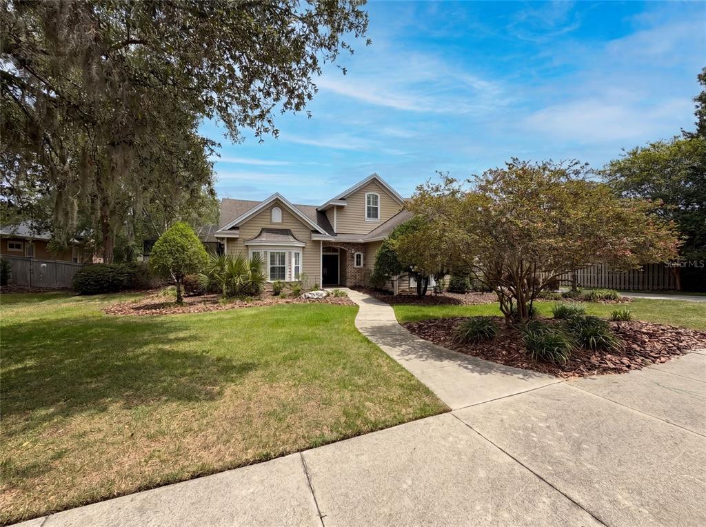 13478 Northwest 9 Road Newberry, FL 32669 - Photo 1 of 31 a front view of house with a garden