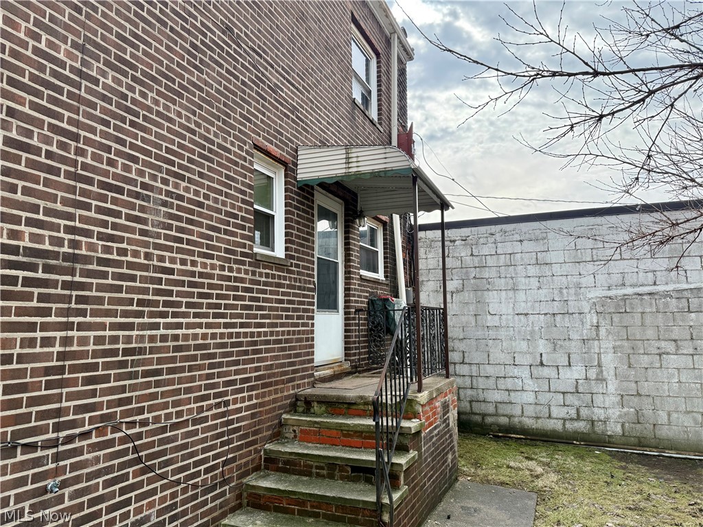 4652 Warner Road, Unit 3 Cleveland, OH 44125 - Photo 2 of 13 View of exterior entry with brick siding