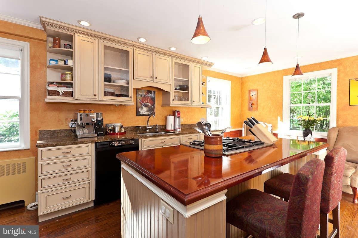 2510 Pickwick Road Baltimore, MD 21207 - Photo 11 of 30 a kitchen with stainless steel appliances granite countertop a stove and a sink