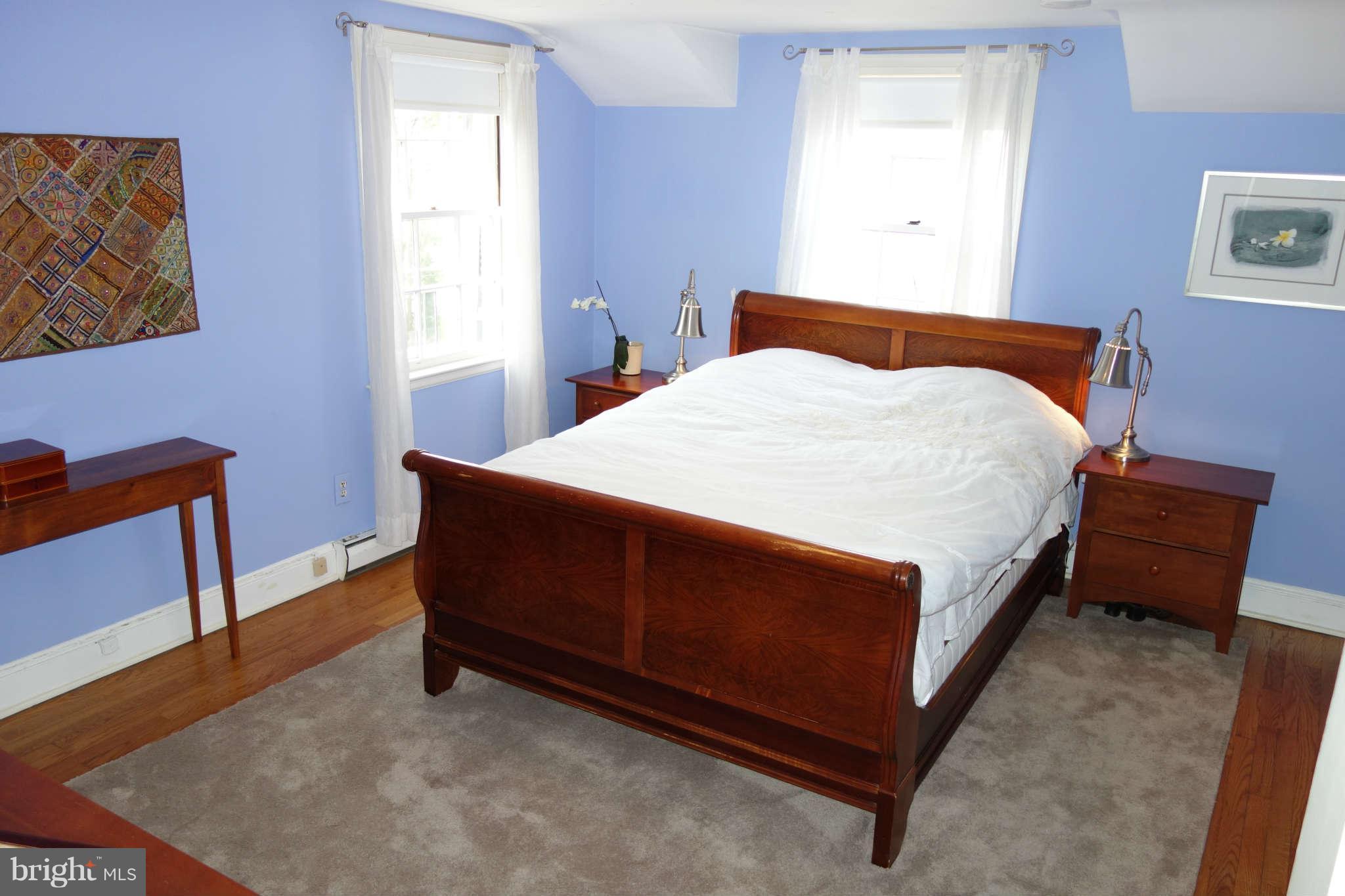 2510 Pickwick Road Baltimore, MD 21207 - Photo 15 of 30 a bed sitting in a bedroom next to a window