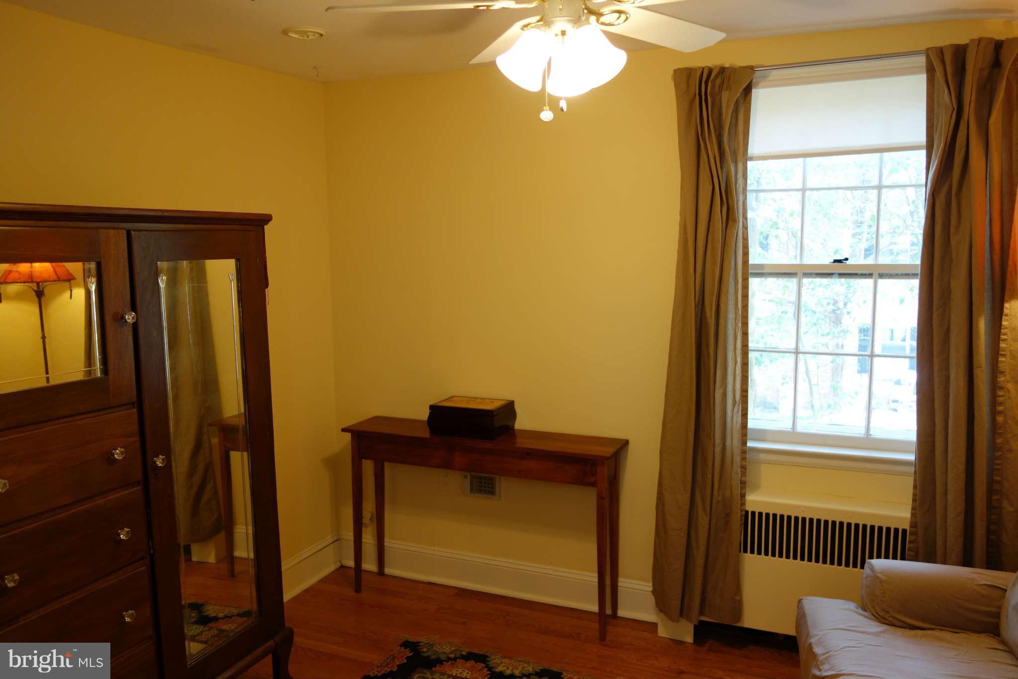 2510 Pickwick Road Baltimore, MD 21207 - Photo 17 of 30 a view of bedroom with furniture and windows
