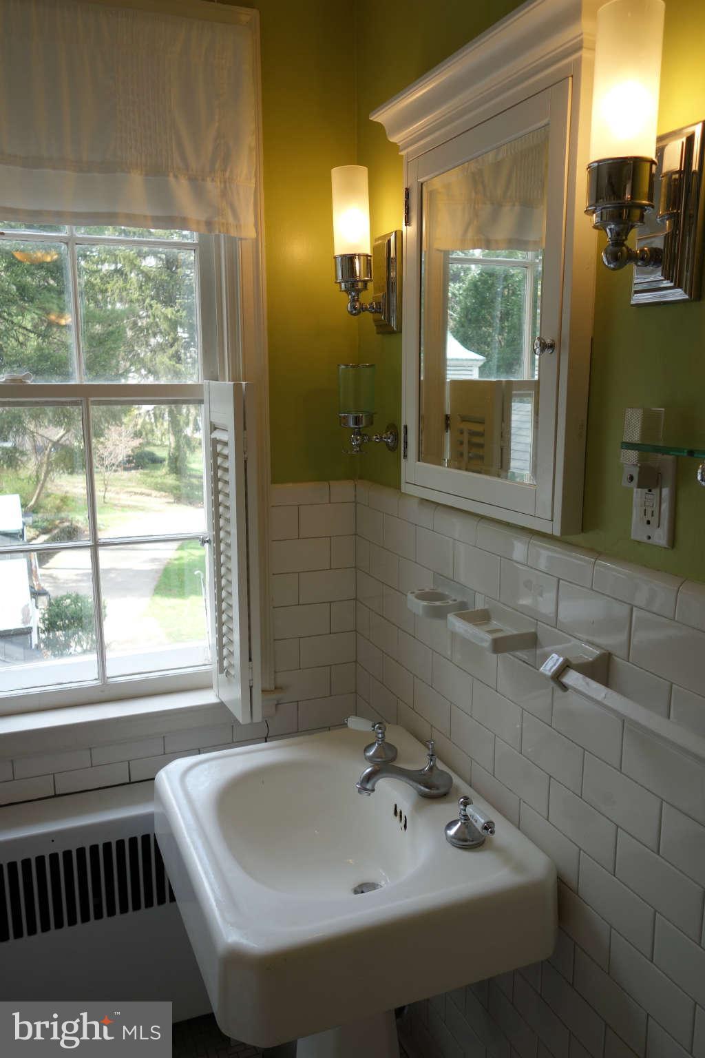 2510 Pickwick Road Baltimore, MD 21207 - Photo 20 of 30 a bathroom with a sink and a bathtub