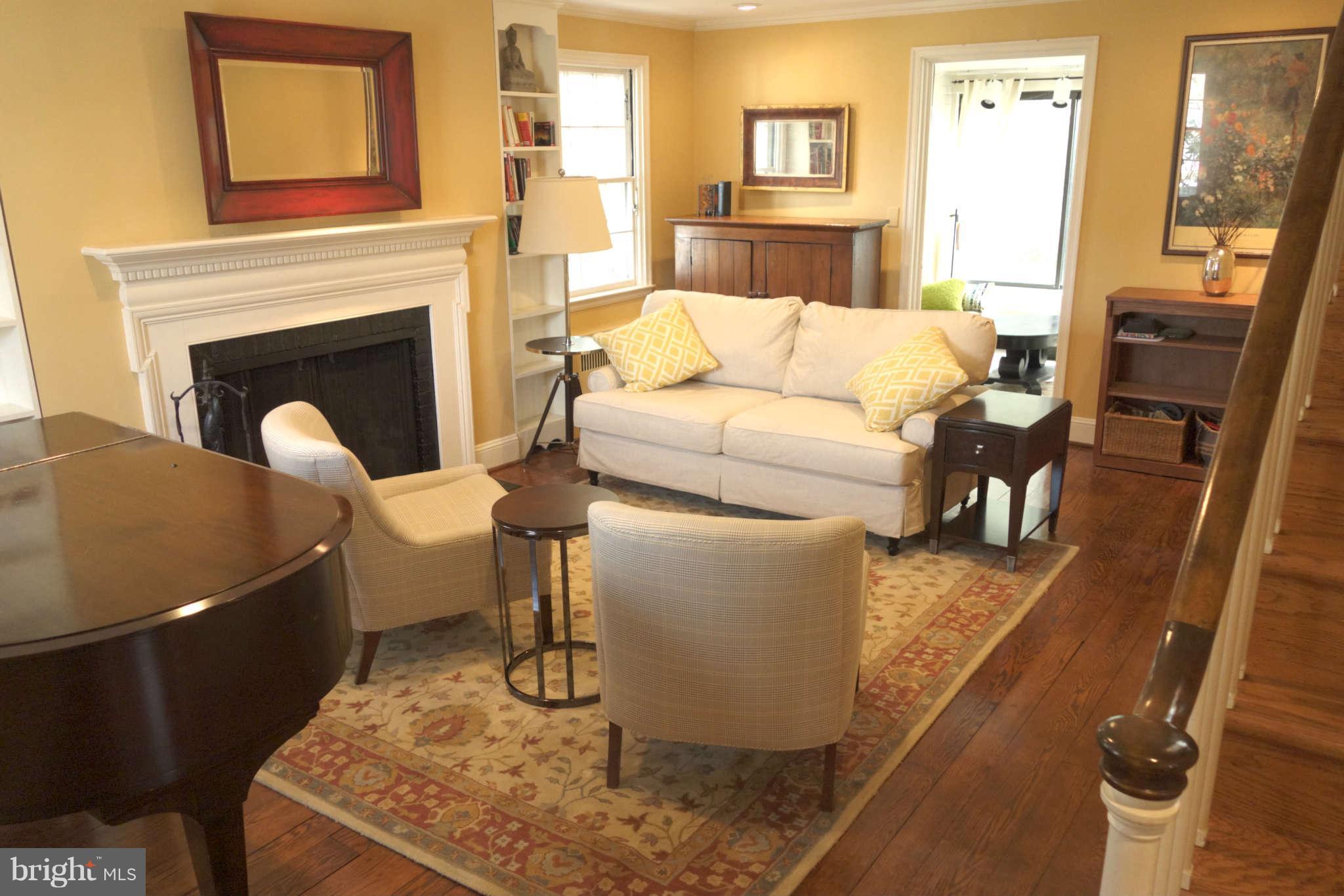 2510 Pickwick Road Baltimore, MD 21207 - Photo 3 of 30 a living room with furniture and a fireplace