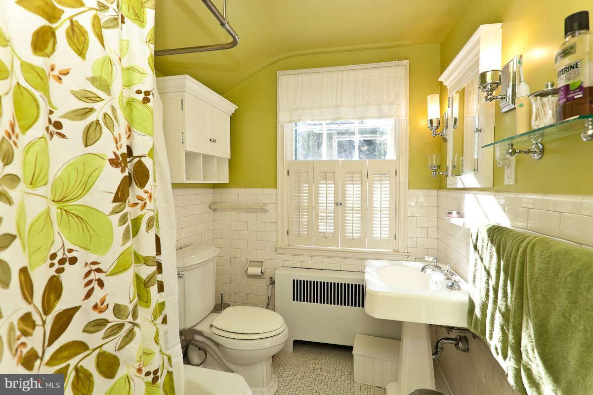 2510 Pickwick Road Baltimore, MD 21207 - Photo 21 of 30 a bathroom with a sink toilet and shower
