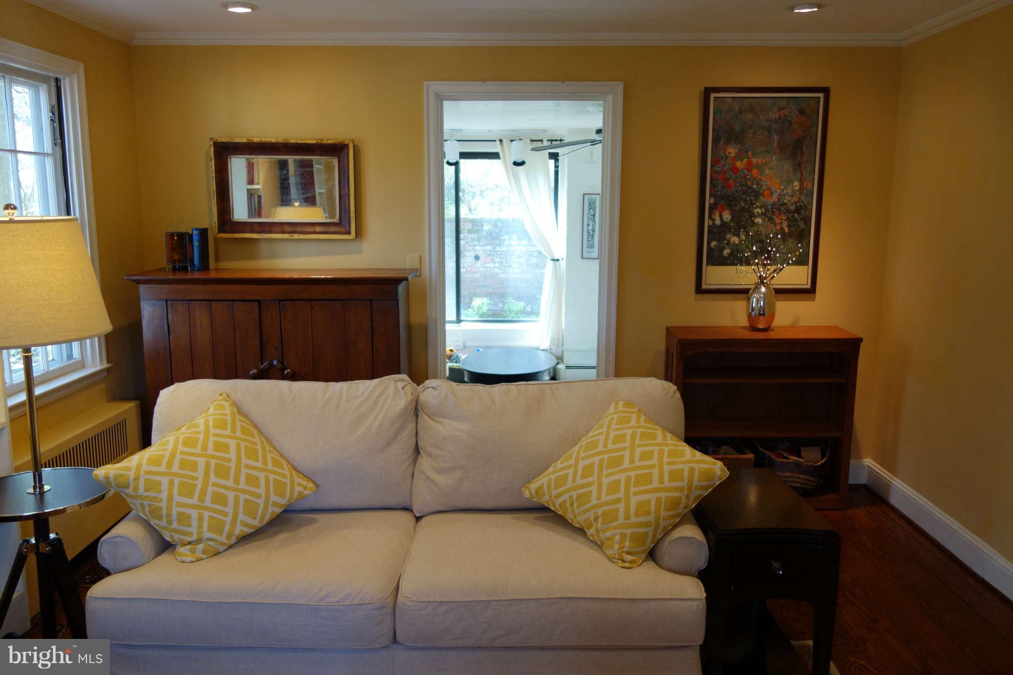 2510 Pickwick Road Baltimore, MD 21207 - Photo 5 of 30 a living room with furniture and a lamp