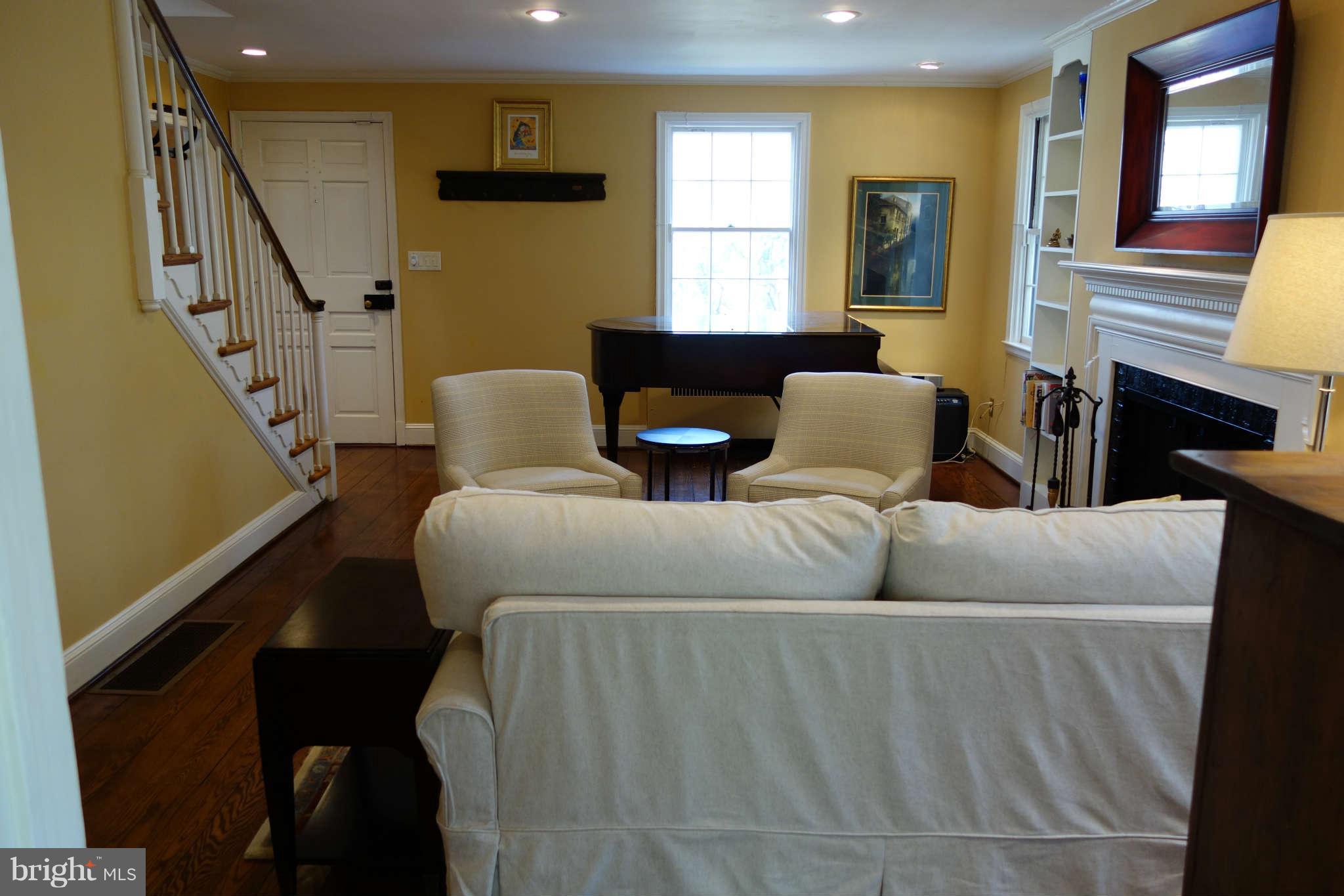 2510 Pickwick Road Baltimore, MD 21207 - Photo 6 of 30 a living room with furniture and a fireplace