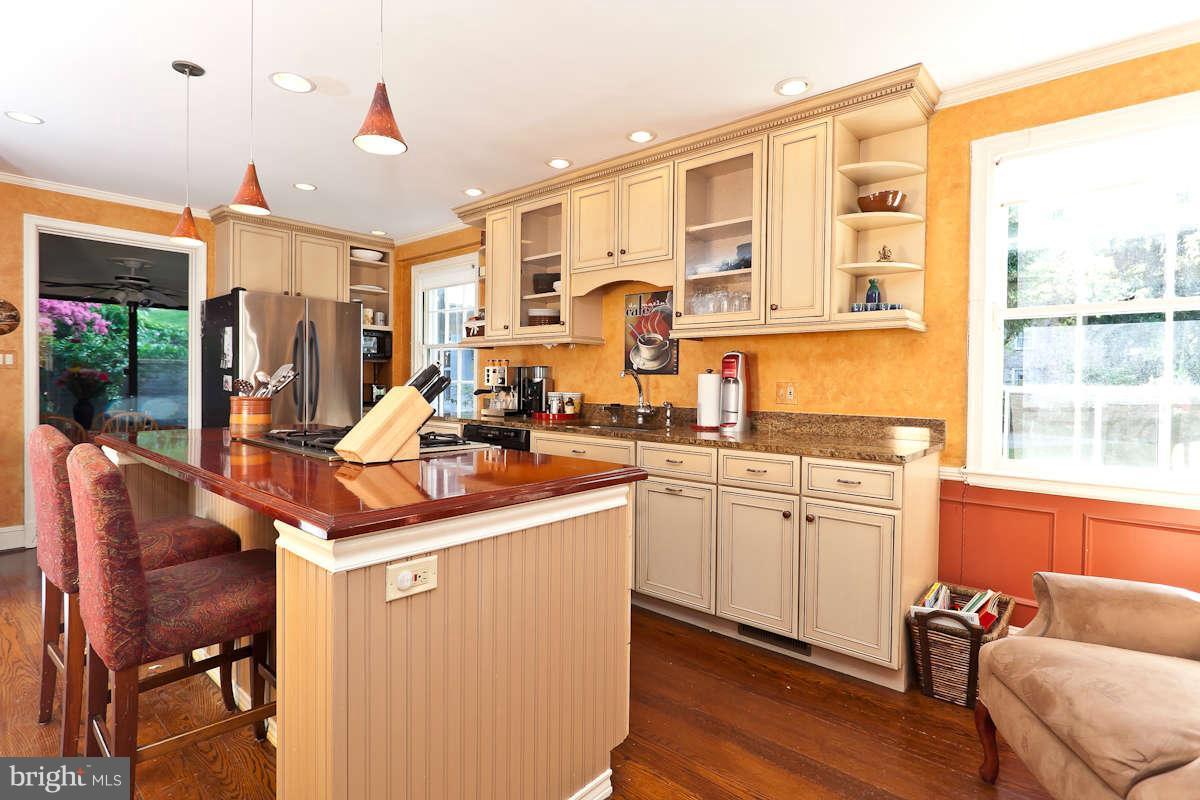 2510 Pickwick Road Baltimore, MD 21207 - Photo 9 of 30 a kitchen with stainless steel appliances granite countertop a sink and cabinets