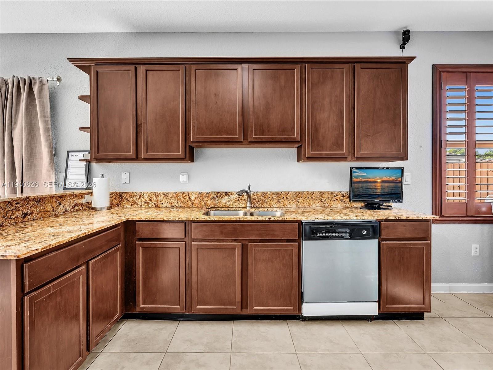 625 Southeast 30th Terrace Homestead, FL 33033 - Photo 17 of 71 a kitchen with a cabinets and appliances