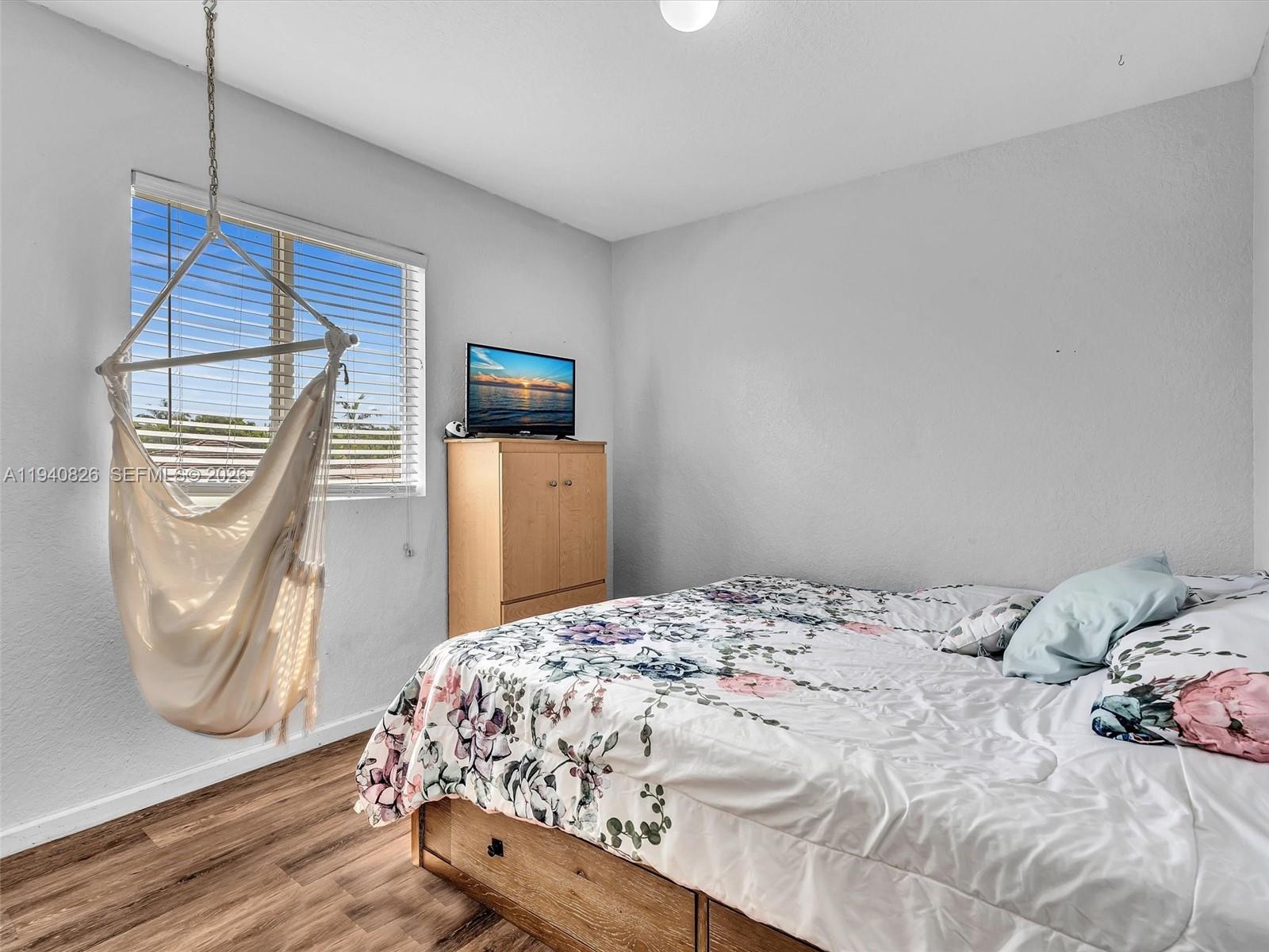 625 Southeast 30th Terrace Homestead, FL 33033 - Photo 25 of 71 a bedroom with a bed and a mirror