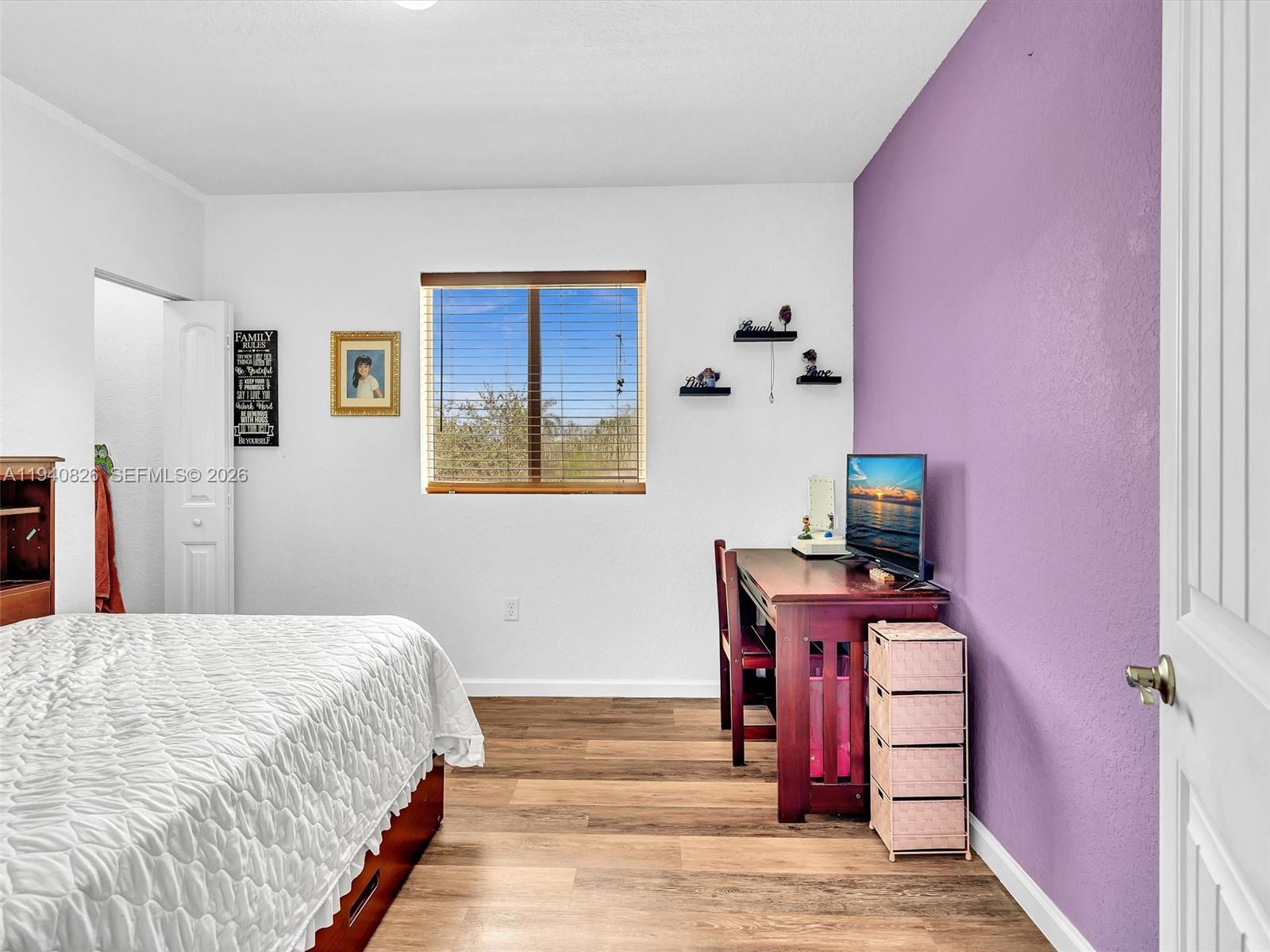 625 Southeast 30th Terrace Homestead, FL 33033 - Photo 29 of 71 a bedroom with a bed and a desk