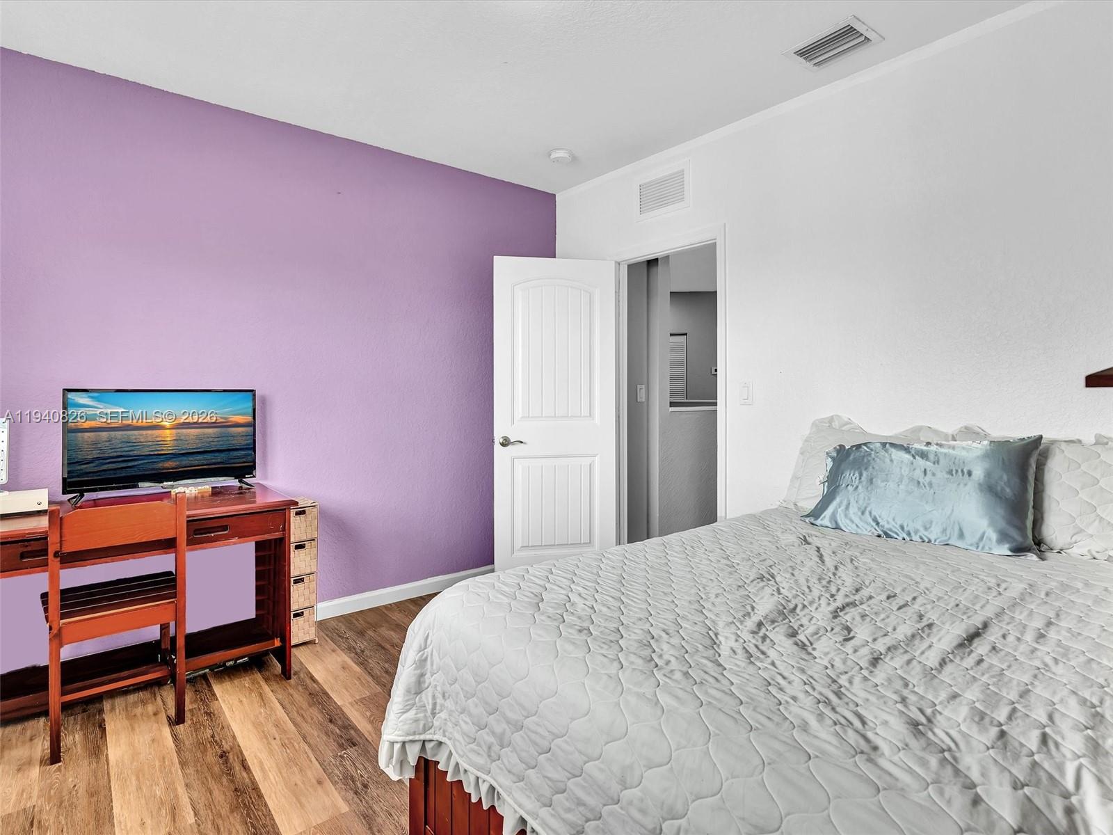 625 Southeast 30th Terrace Homestead, FL 33033 - Photo 30 of 71 a bedroom with a bed and a flat screen tv