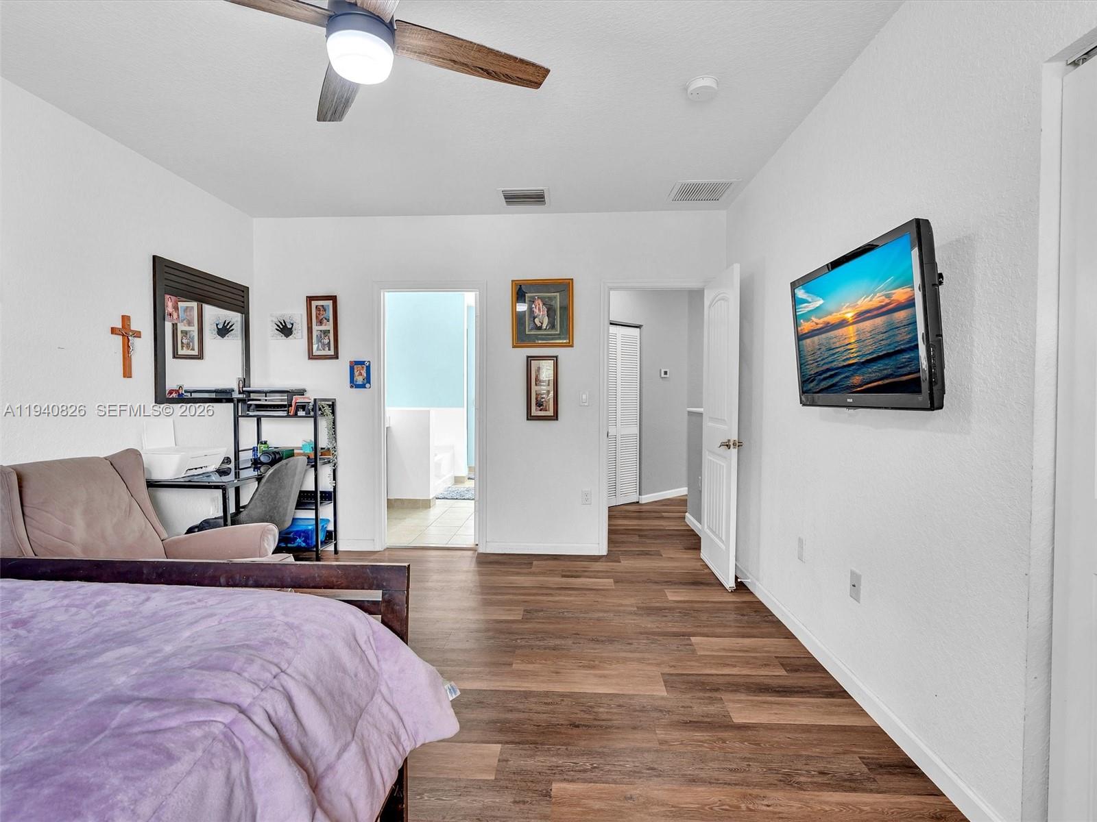 625 Southeast 30th Terrace Homestead, FL 33033 - Photo 32 of 71 a bedroom with bed and a flat screen tv