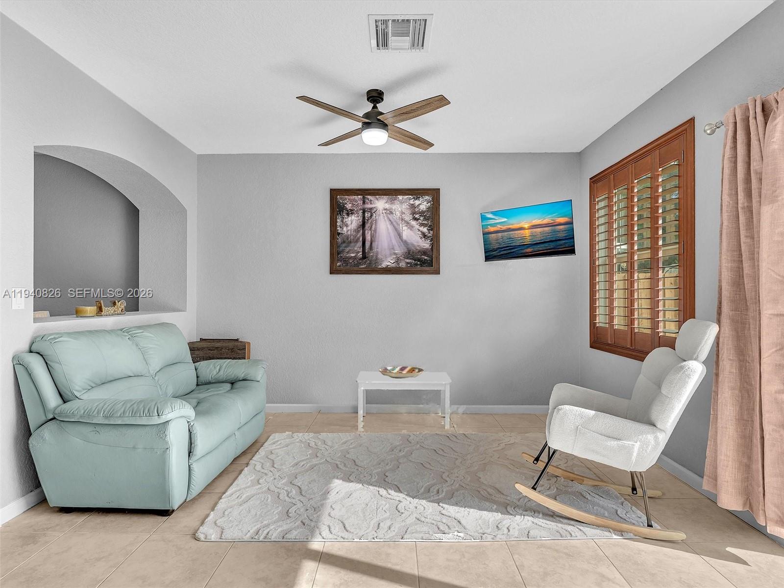 625 Southeast 30th Terrace Homestead, FL 33033 - Photo 5 of 71 a living room with furniture and a window