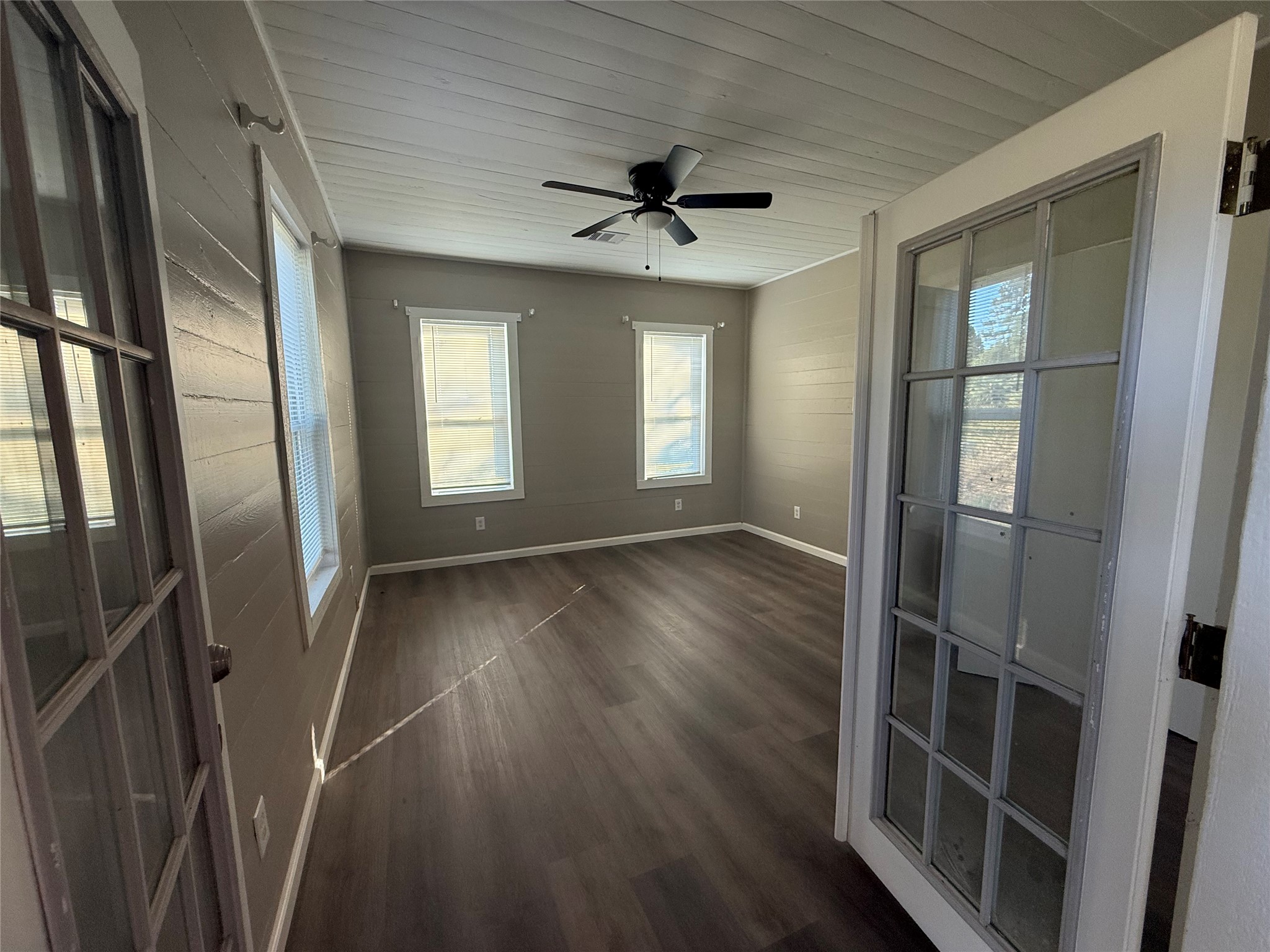 10534 Hufsmith Road Tomball, TX 77375 - Photo 15 of 34 wooden floor in an empty room with a window