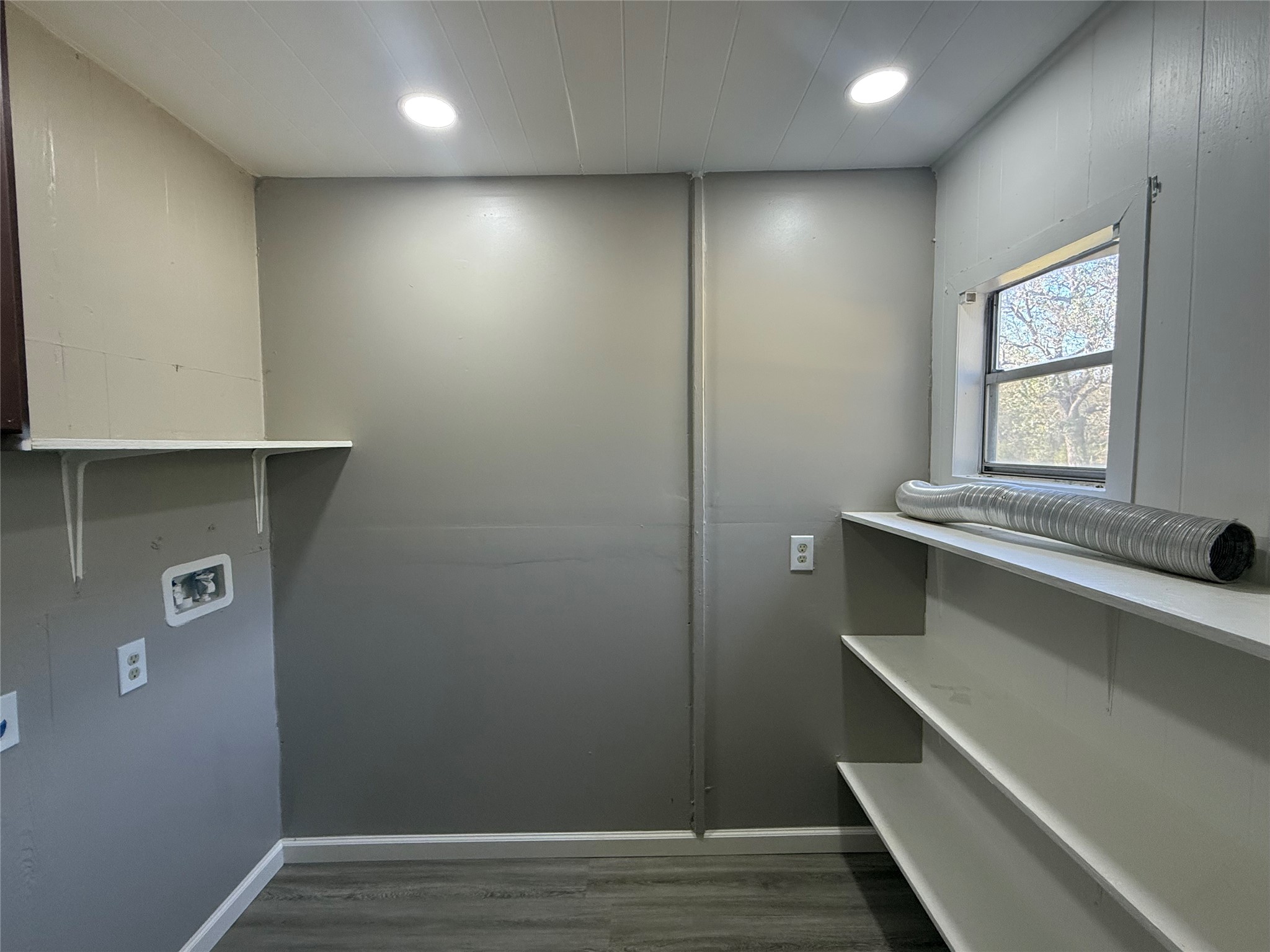 10534 Hufsmith Road Tomball, TX 77375 - Photo 24 of 34 a view of room with window and wooden floor