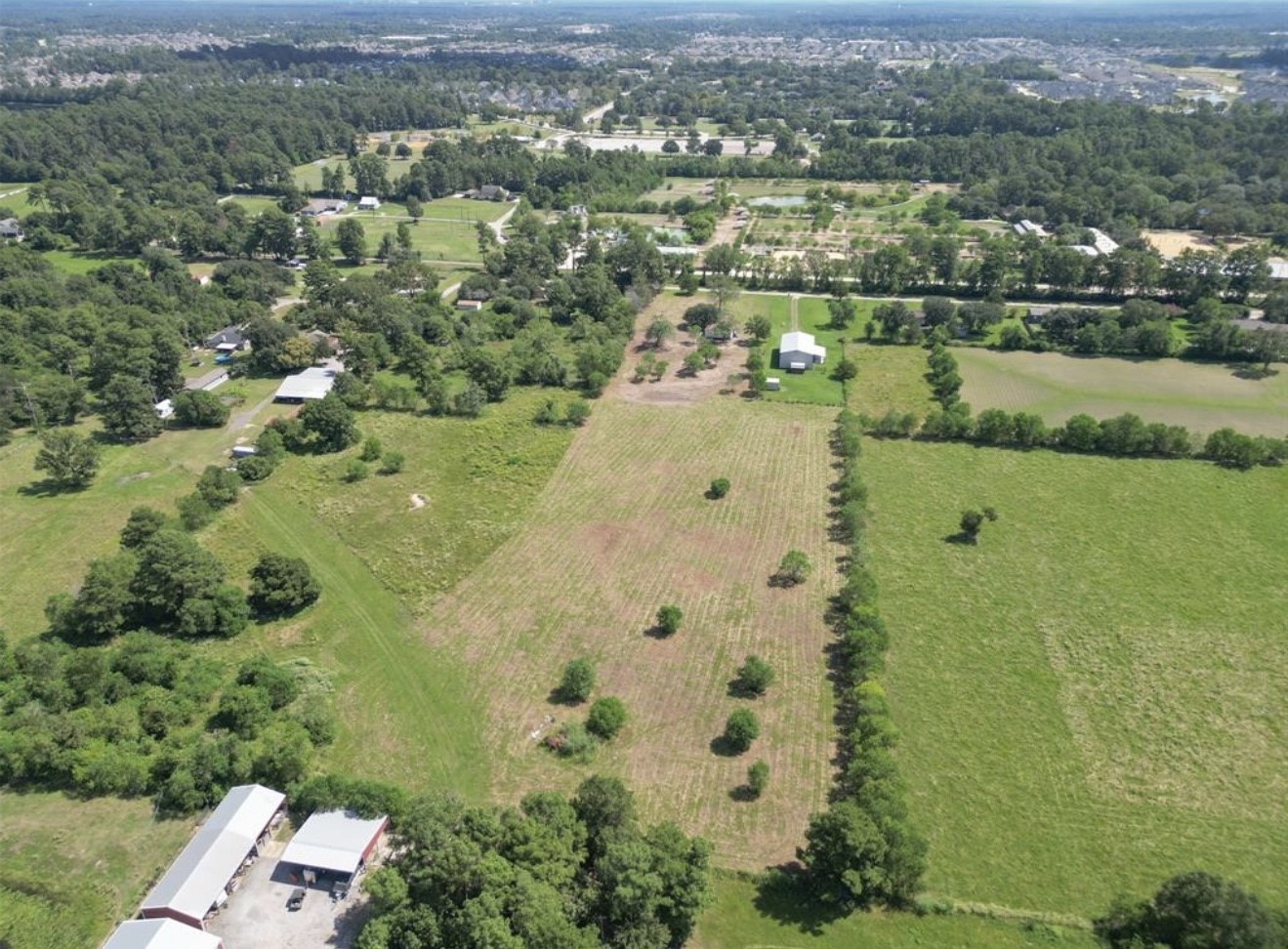 10534 Hufsmith Road Tomball, TX 77375 - Photo 33 of 34 an aerial view of a residential houses with outdoor space and trees