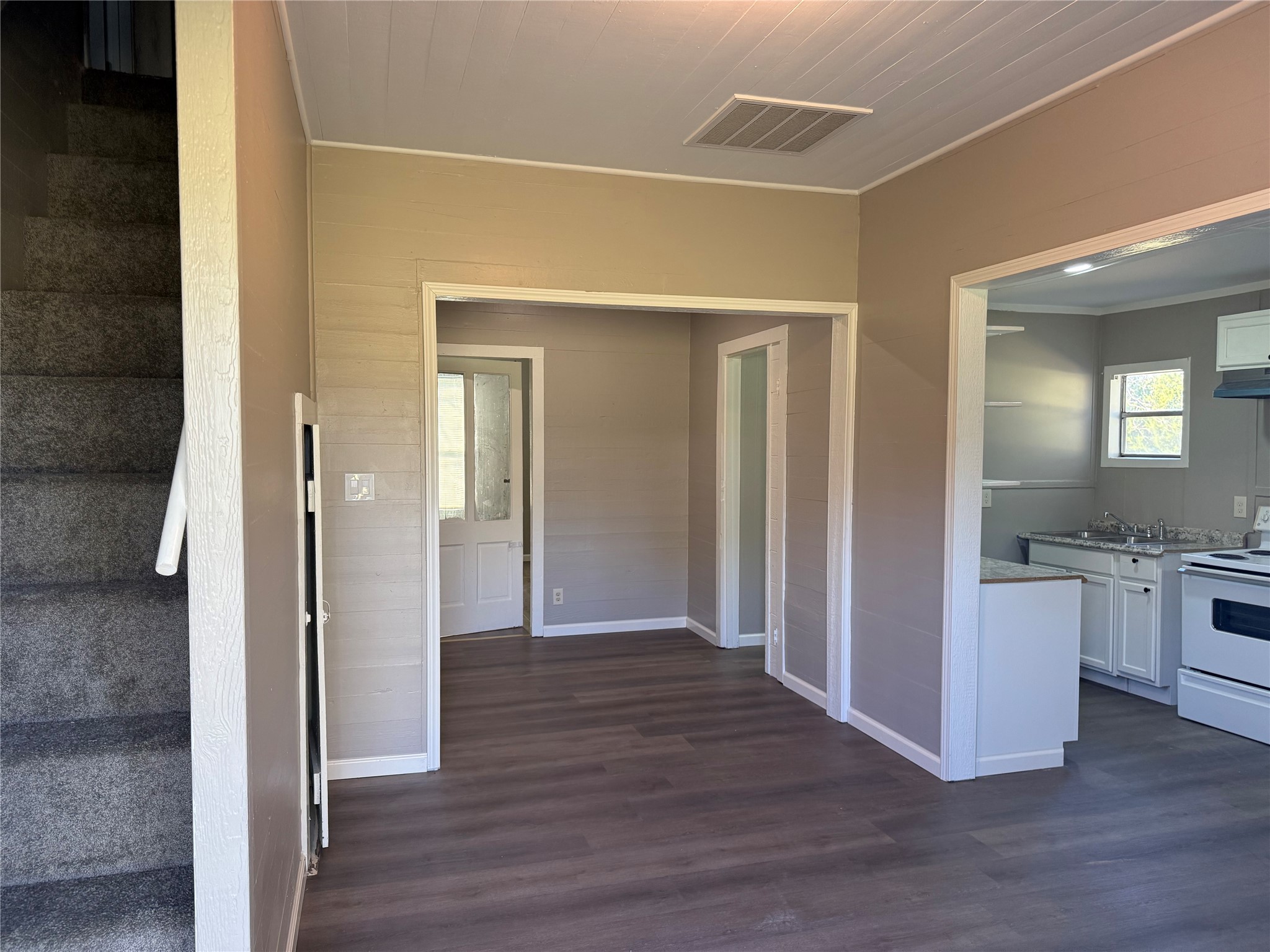 10534 Hufsmith Road Tomball, TX 77375 - Photo 10 of 34 a view of a kitchen cabinets and wooden floor