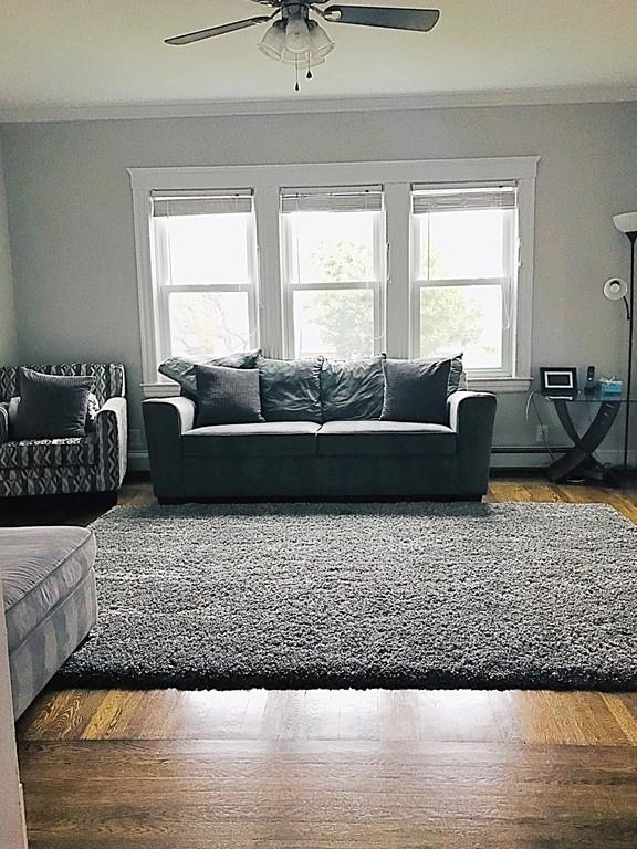 15 Fair Street Hull, MA 02045 - Photo 4 of 8 a living room with furniture window and a wooden floor