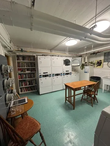 a view of a room that has a large window