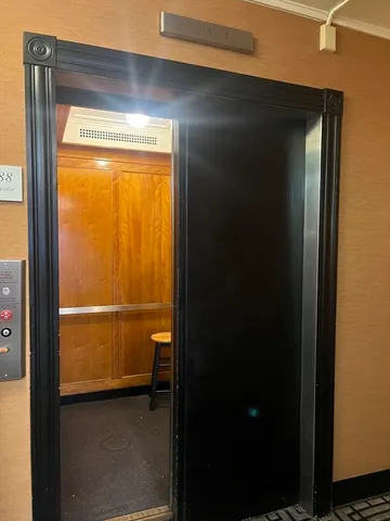 a view of a room that has a large window