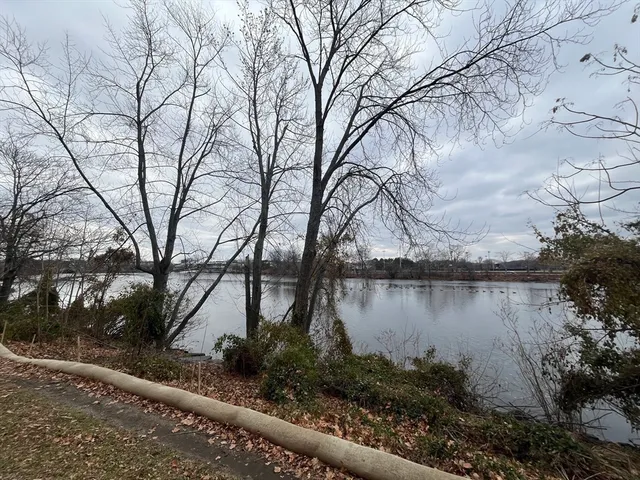 a view of a lake with a house in the background