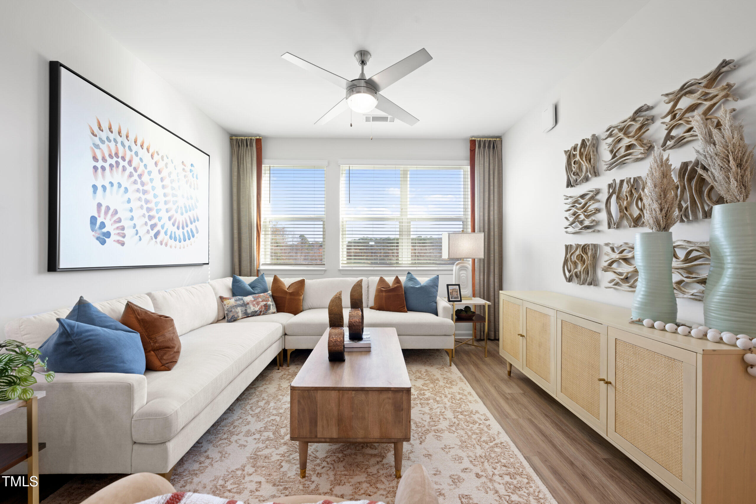 211 Hammond Center Drive, Unit A1 Raleigh, NC 27603 - Photo 13 of 30 a living room with furniture and a large window
