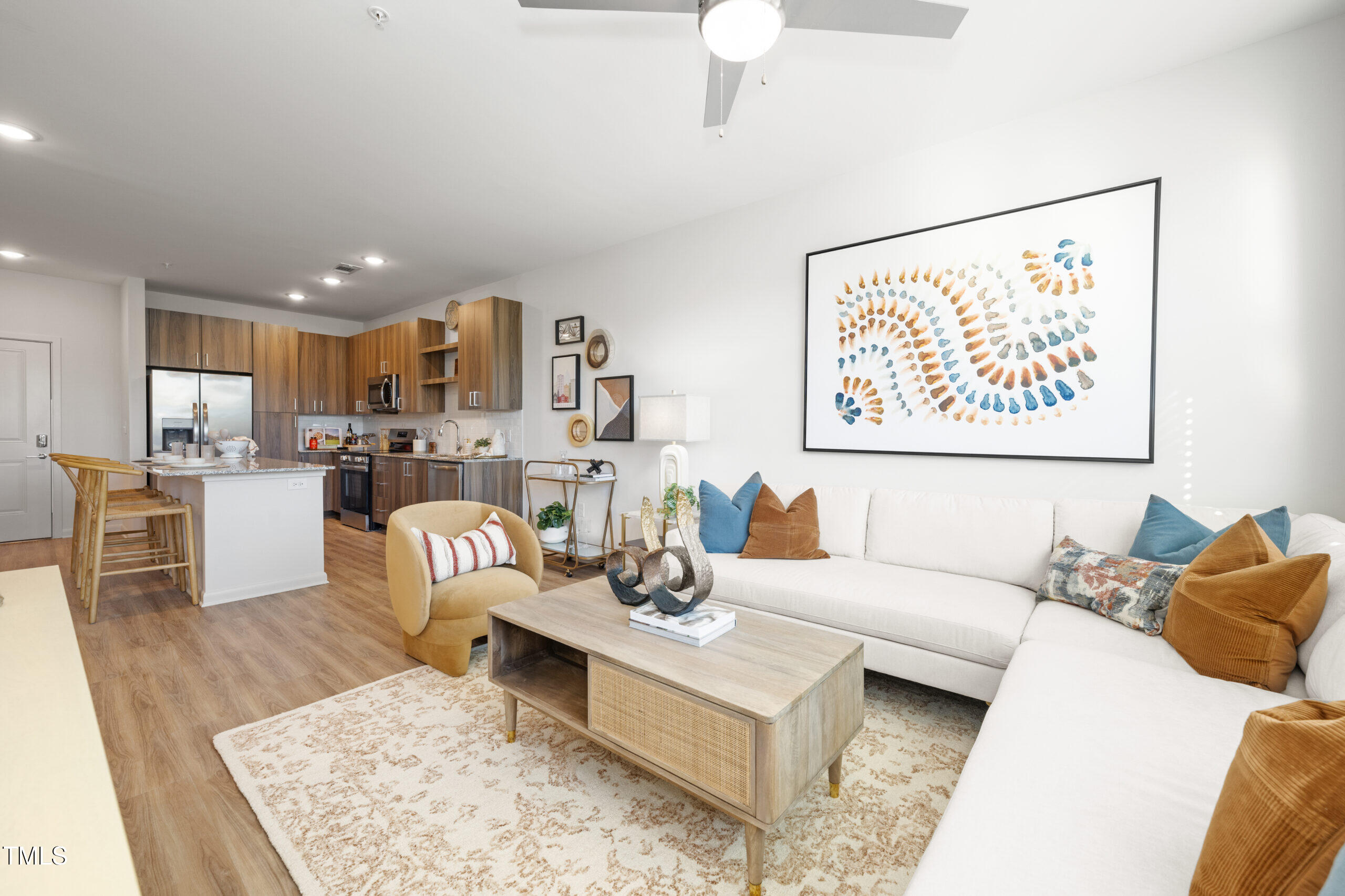211 Hammond Center Drive, Unit A1 Raleigh, NC 27603 - Photo 14 of 30 a living room with furniture and kitchen view