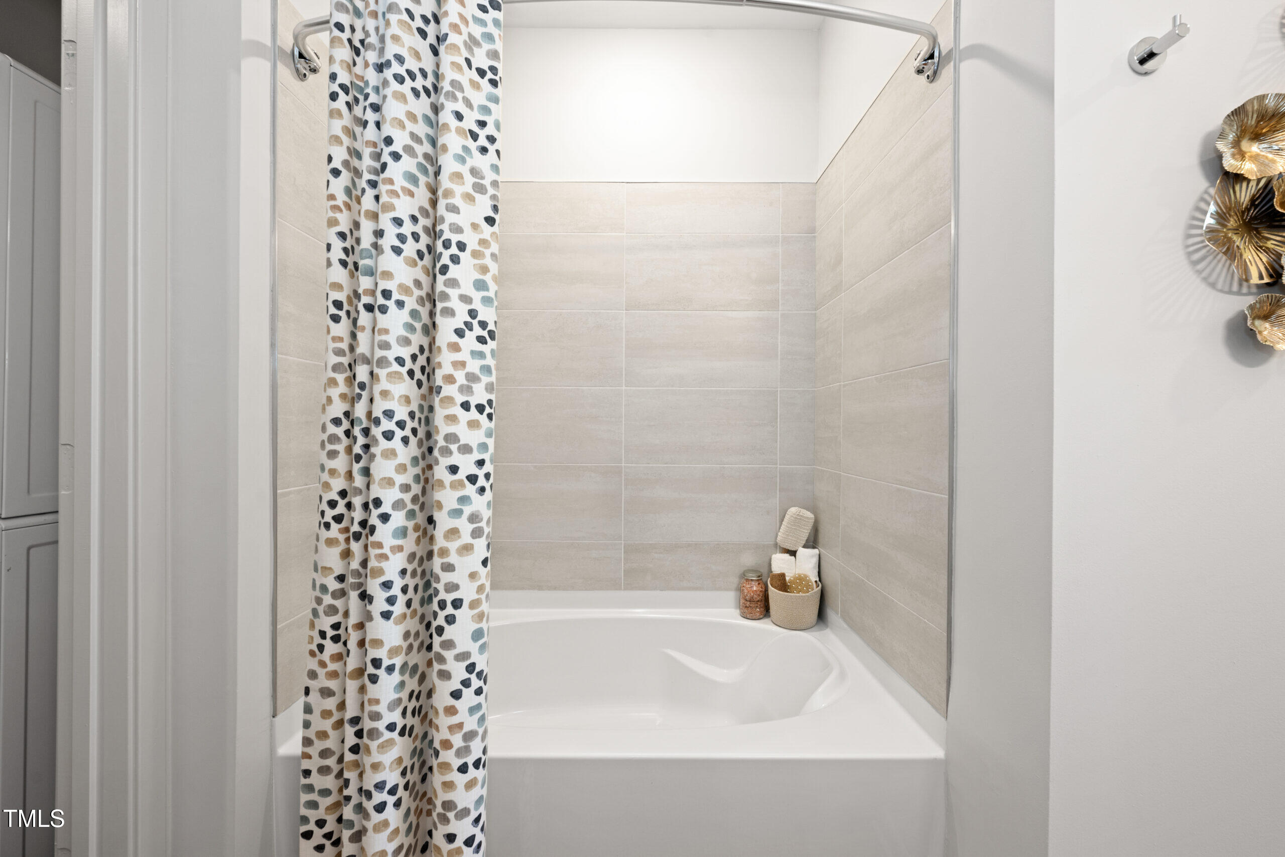 211 Hammond Center Drive, Unit A1 Raleigh, NC 27603 - Photo 18 of 30 a bathroom with a bathtub and shower