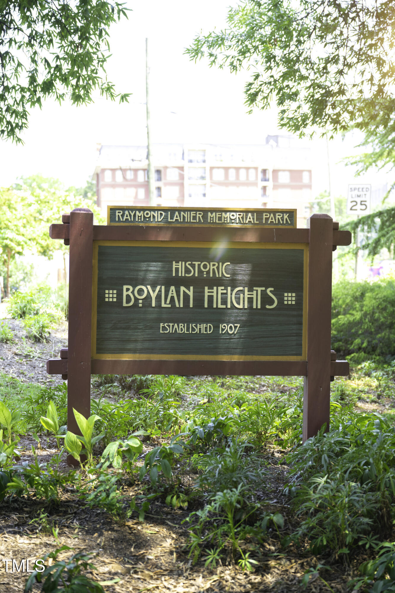 211 Hammond Center Drive, Unit A1 Raleigh, NC 27603 - Photo 29 of 30 a view of outdoor space with signage and flags