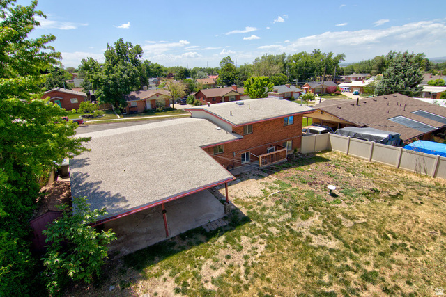 1272 Cook Street Ogden, UT 84404 - Photo 34 of 46 Brick-exterior residence featuring a two-story design, a covered patio, and a dedicated carport