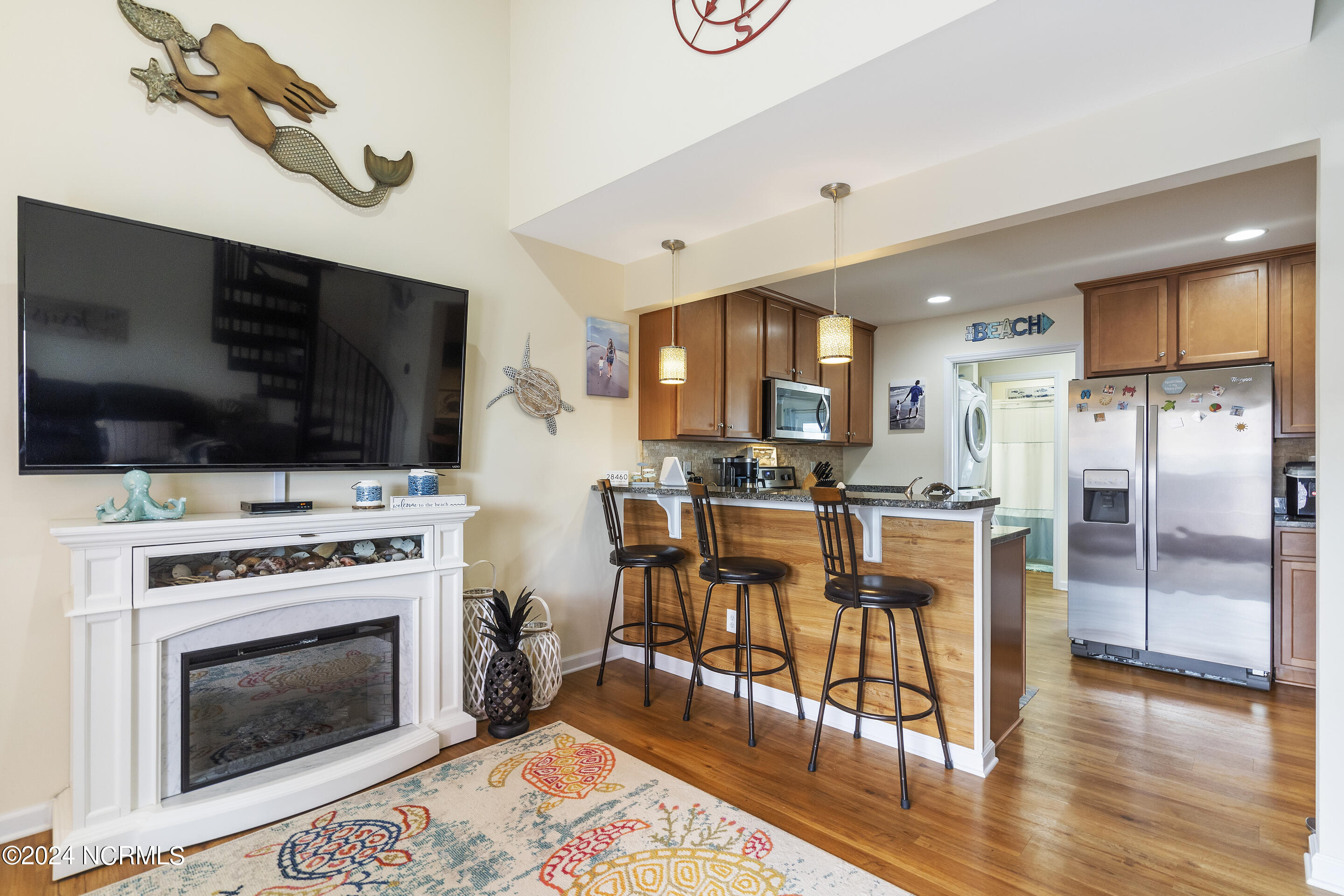 892 New River Inlet Road, Unit 9 North Topsail Beach, NC 28460 - Photo 16 of 74 Electric Plug-in Fireplace and Bar Area